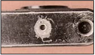 Bottom side of Nikonos III 35mm film camera showing the tripod socket.